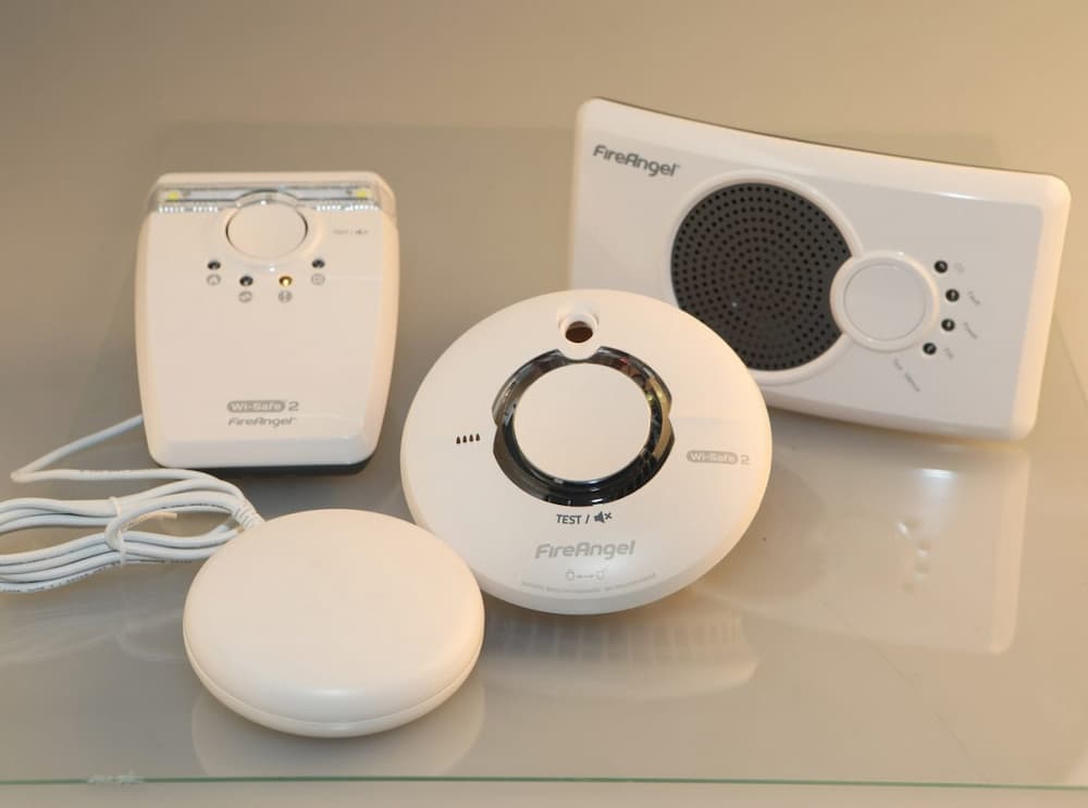 A smoke alarm, carbon monoxide detector and hearing impaired smoke alarm
