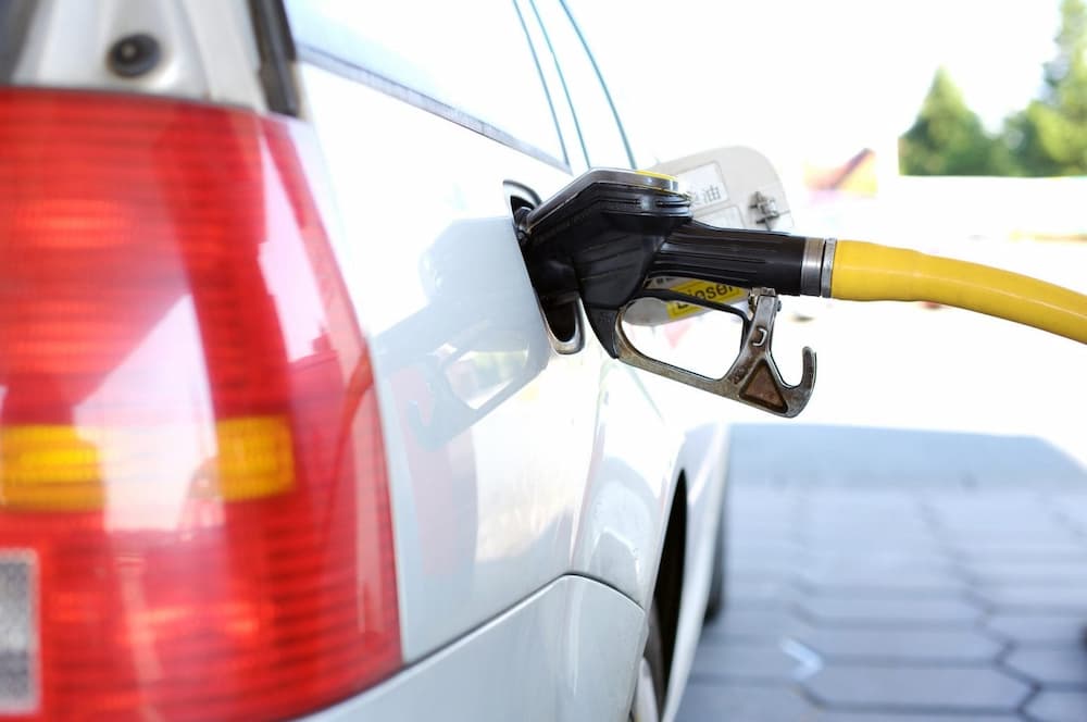 A close up of a fuel pump nozzle in a car