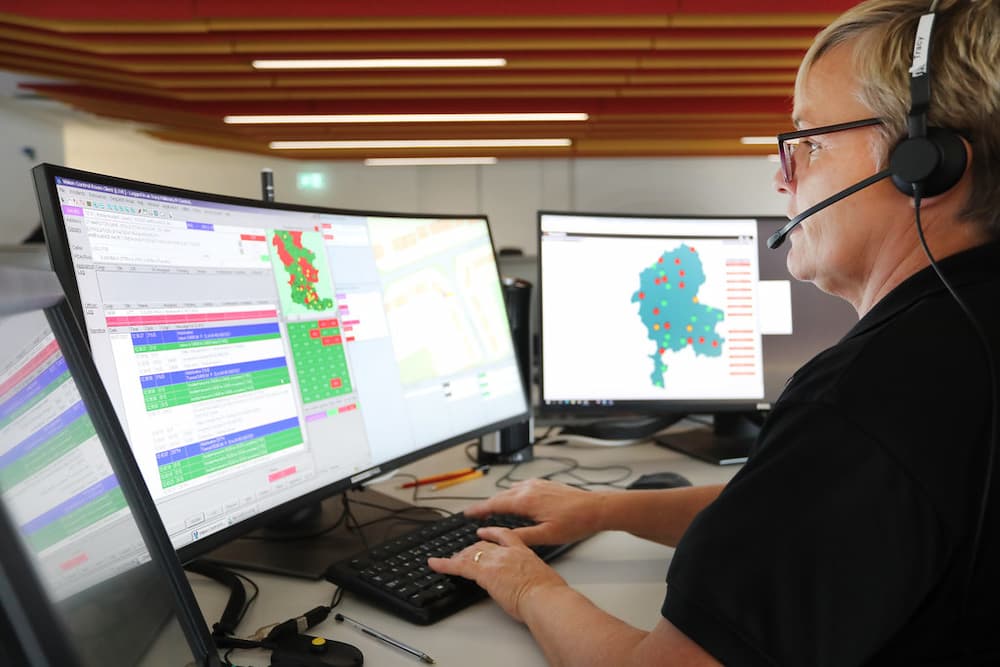 Fire Control staff member working at screens in the control room