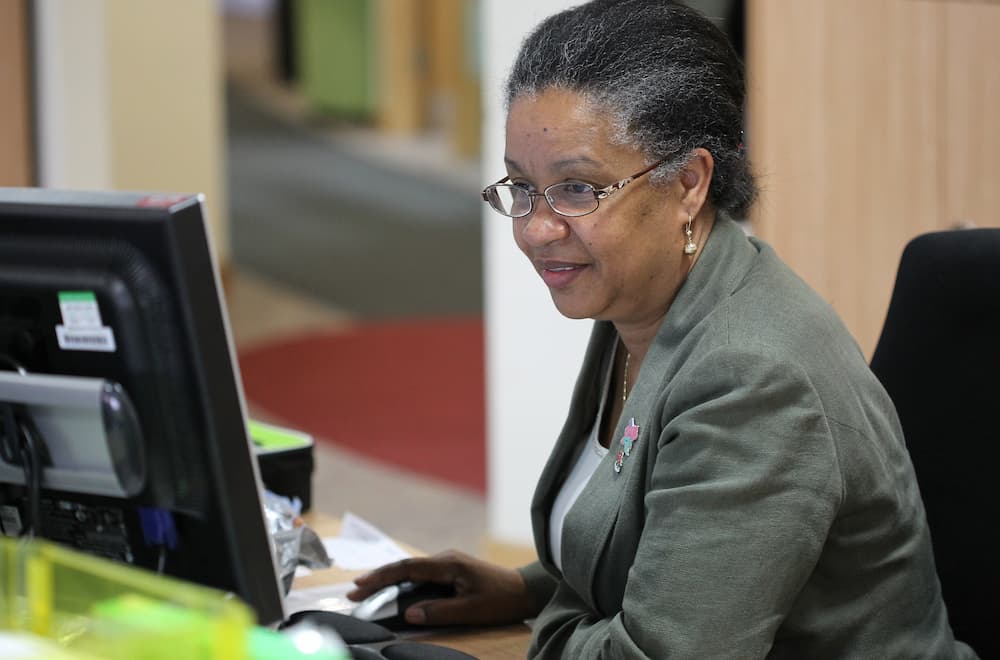 Female member of staff focused on her computer