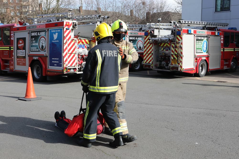 A firefighter candidate dragging a casualty dummy