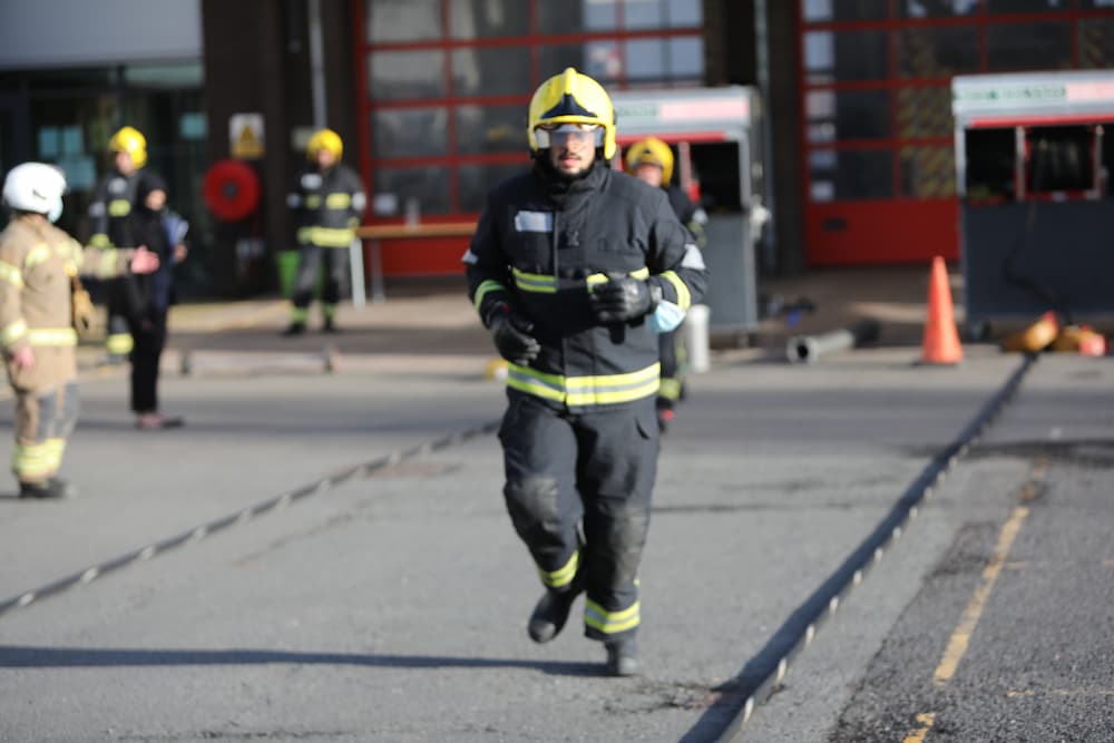 A firefighter candidate running a 25 metre course