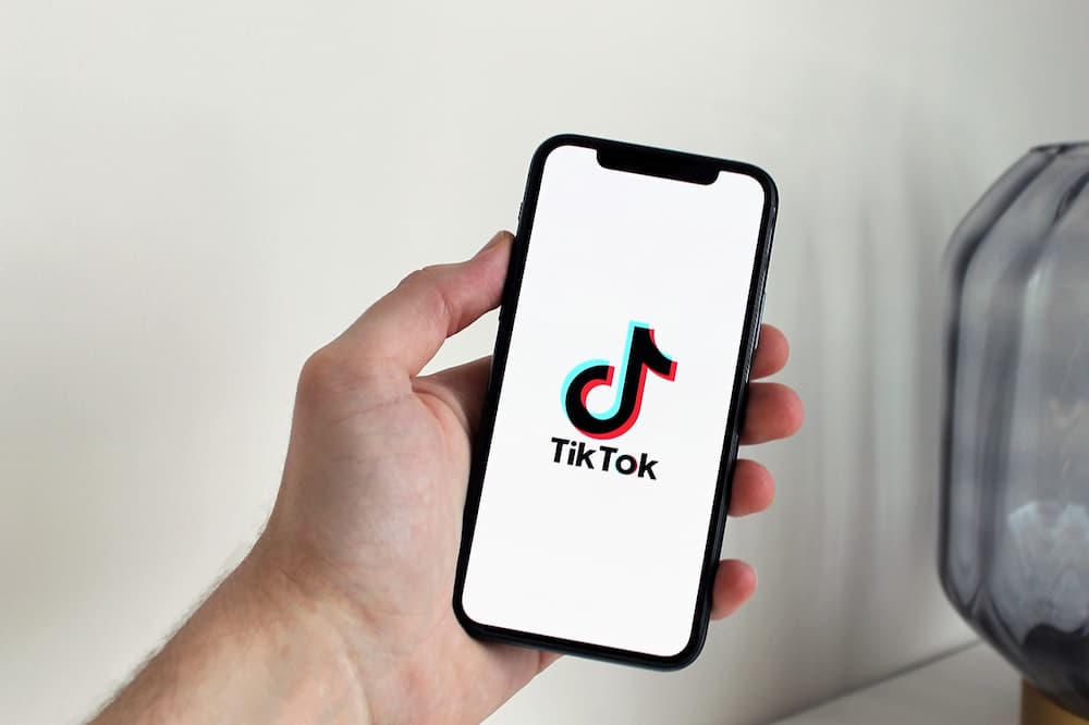 A phone showing the TikTok logo on it