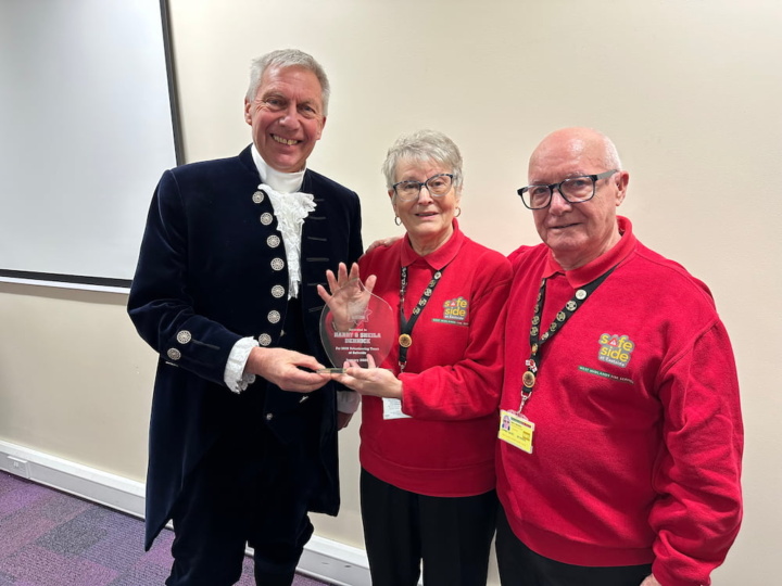 Harry and Sheila stood with High Sheriff of the County of the West MidlandsDavid Moorcroft.