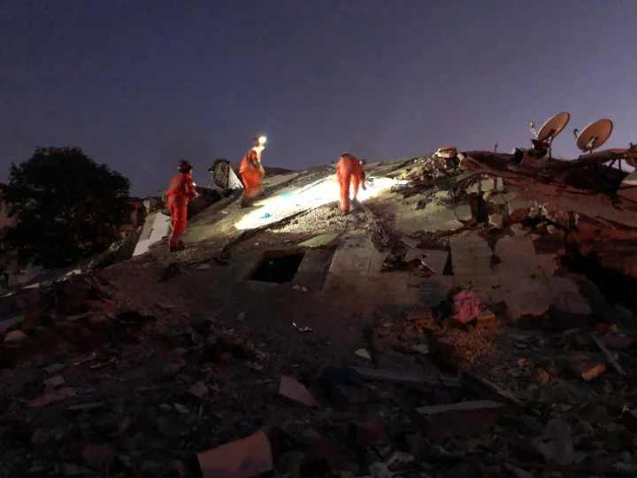 UKISAR personnel working on a heap of rubble