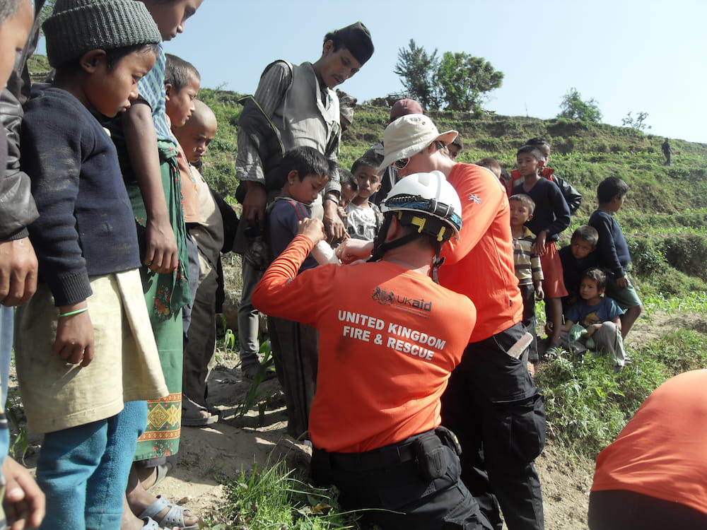 UKISAR volunteers helping community members in Nepal following their deployment there in 2015.