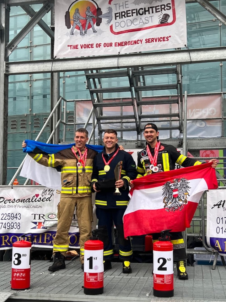 Firefighter Jack Baker stood with 2nd and 3rd place winners