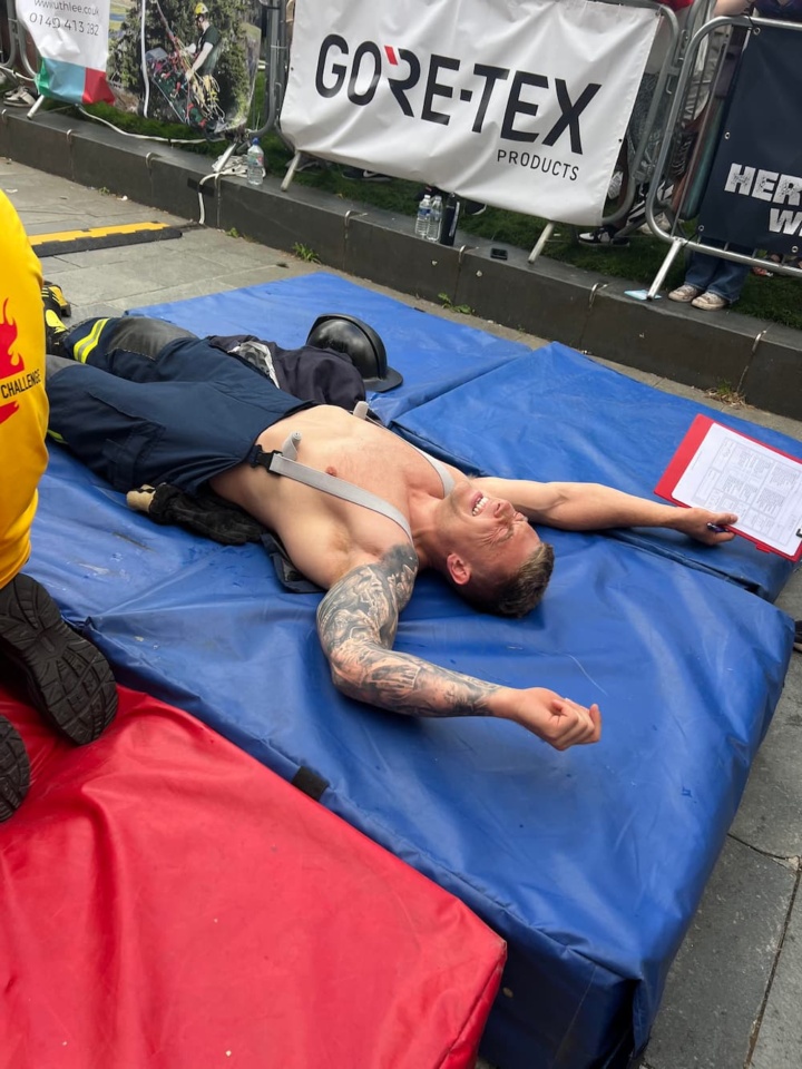 Firefighter Jack Baker lay down on a mat after his challenge