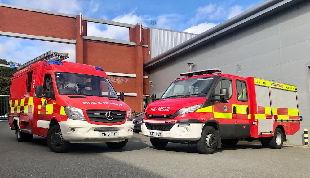 Two liveried fire service vehicles parked together