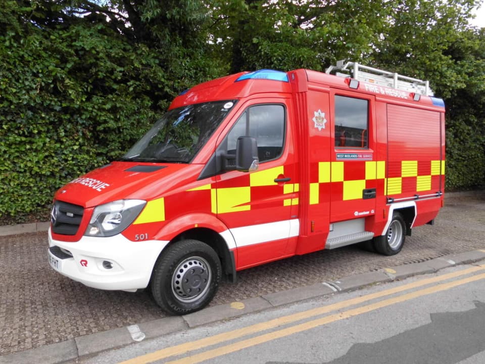 A liveried fire service vehicle, viewed from front left