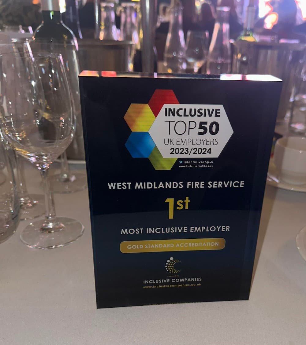 A photograph of the award for the Top 50 Inclusive Employers, showing WMFS in 1st place, on a table.