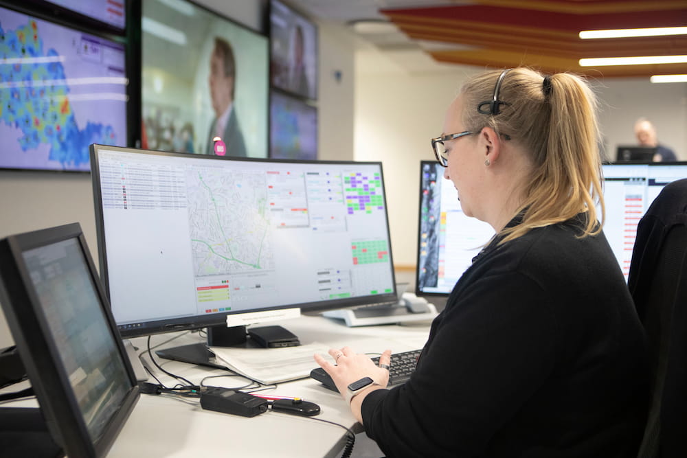 A Fire Control operator looking at her screens and typing in Fire Control