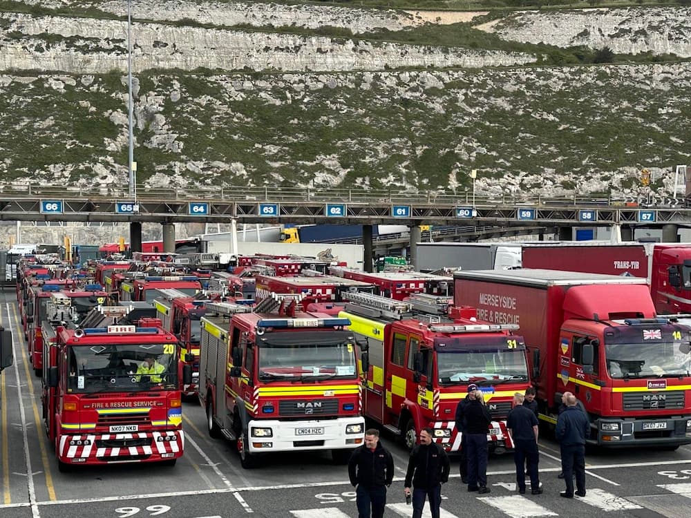 Several fire engines parked at a port